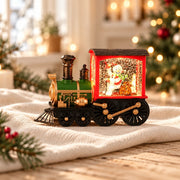 Train de Noël lumineux rouge et vert avec bonhomme de neige, dans un décor ivoire et doré
